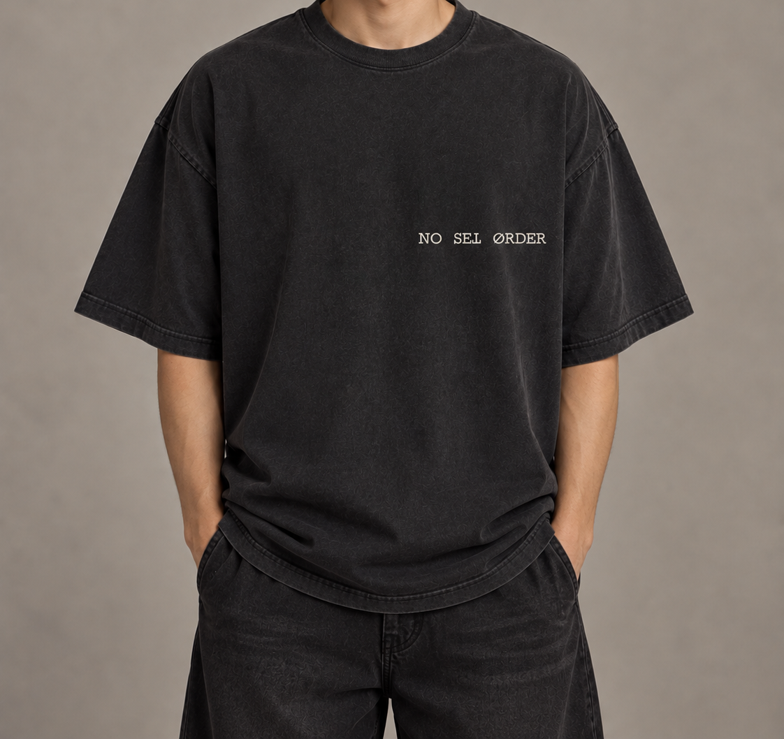 No Set Order Edition 001 oversized T-shirt worn from the front without the model's face, showing the off-center wordmark